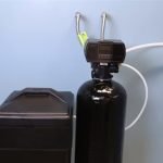 how much water is discharged from a water softener during regeneration