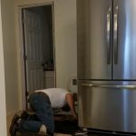 how to move a refrigerator to clean behind